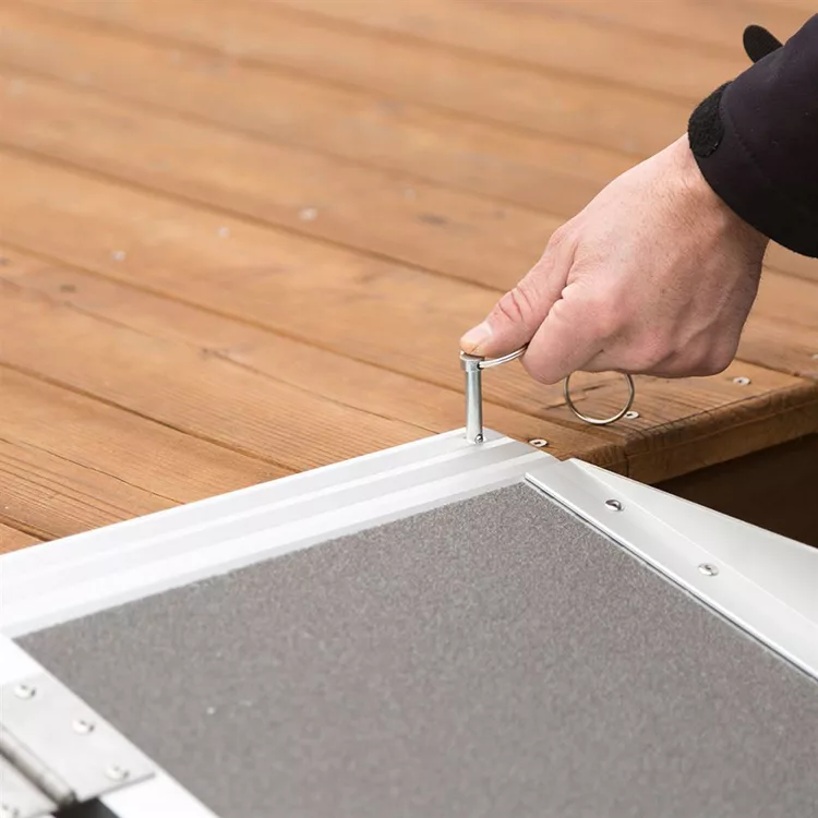 security lock being put in place on the Folding Suitcase Ramp