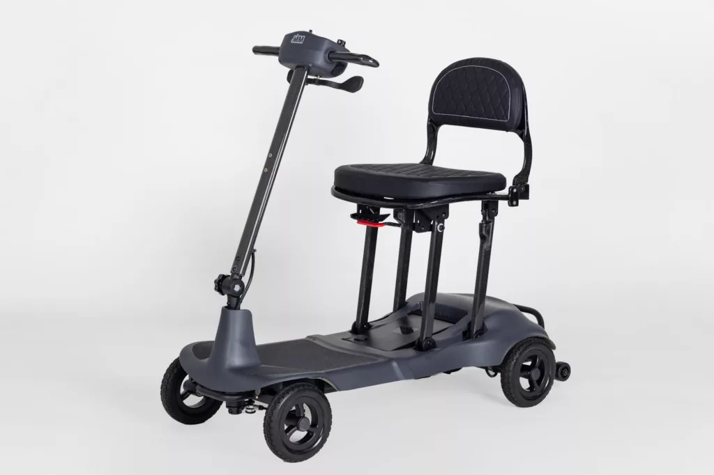 A grey Genie Ultralight mobility scooter taken from the front/side