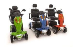 image of 3 mobility scooters in green blue and red colours