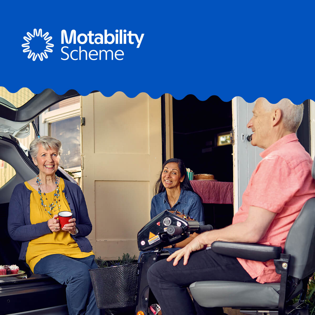 Motability Scheme Logo with 3 people chatting on mobility scooters