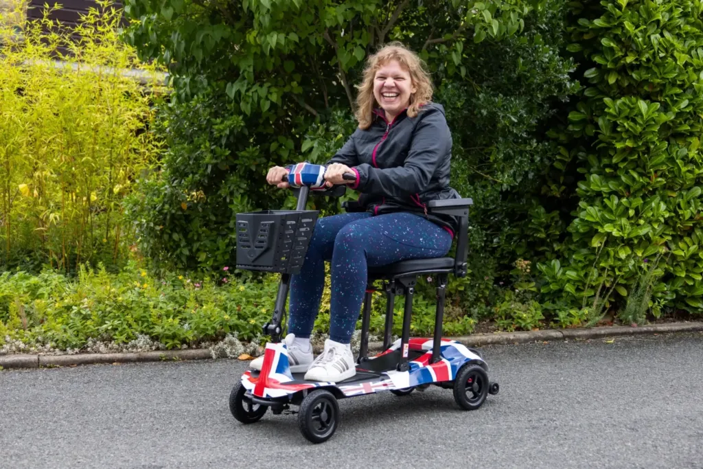 Katie Toft riding her new Genie Ultralight mobility scooter